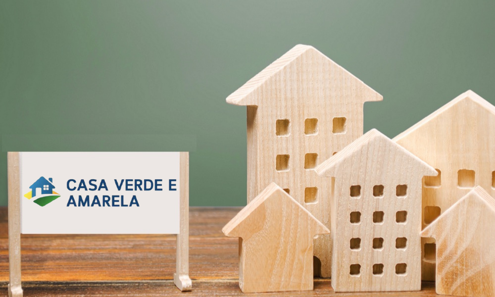 Um cartaz escrito programa casa verde e amarela e casas de madeira. Conceito de planejamento e financiamento imobiliário